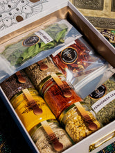Load image into Gallery viewer, Banu&#39;s starter kit box filled with spices.